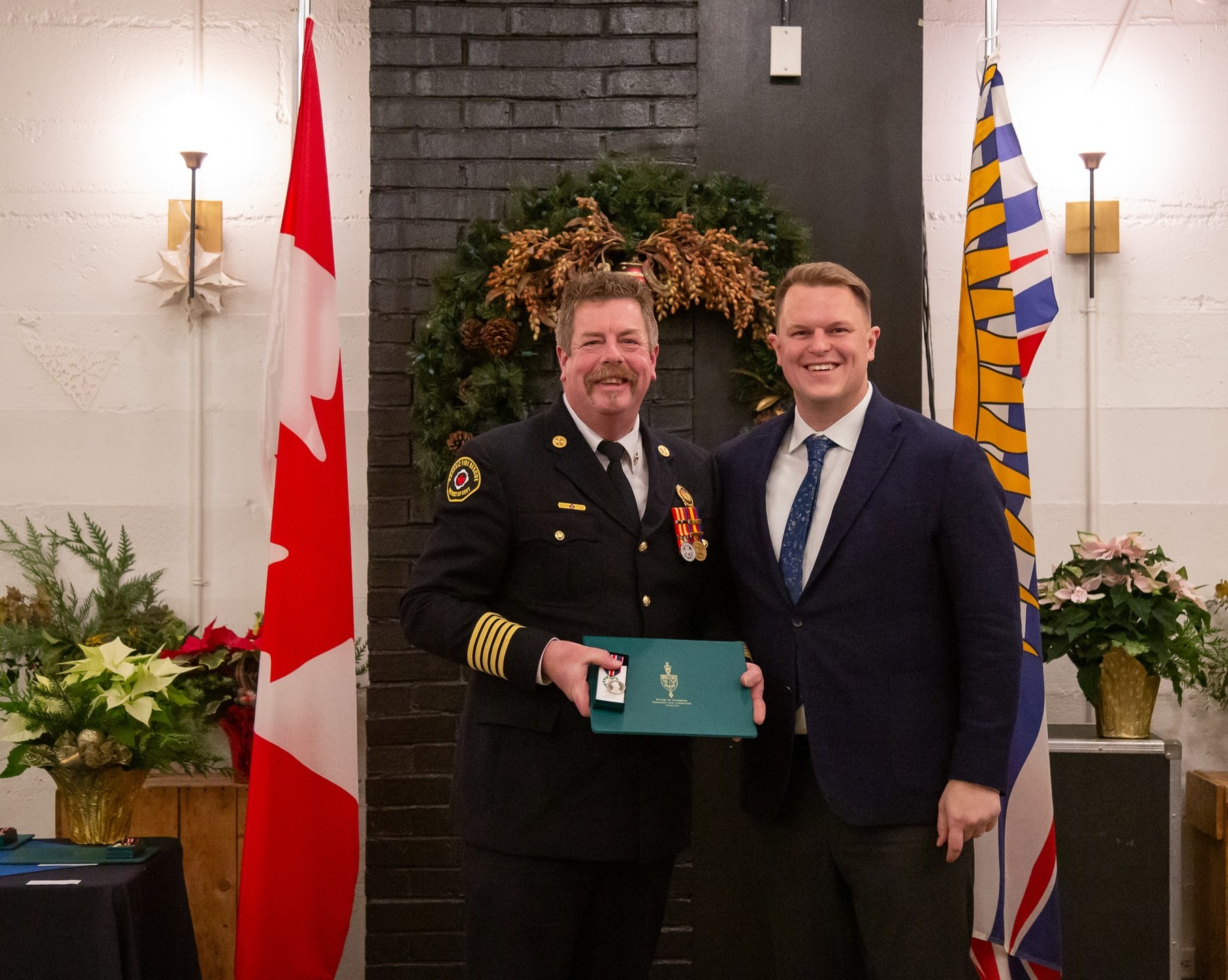 Gerald Basten Recieving the King Charles Medal from MP Brad Vis